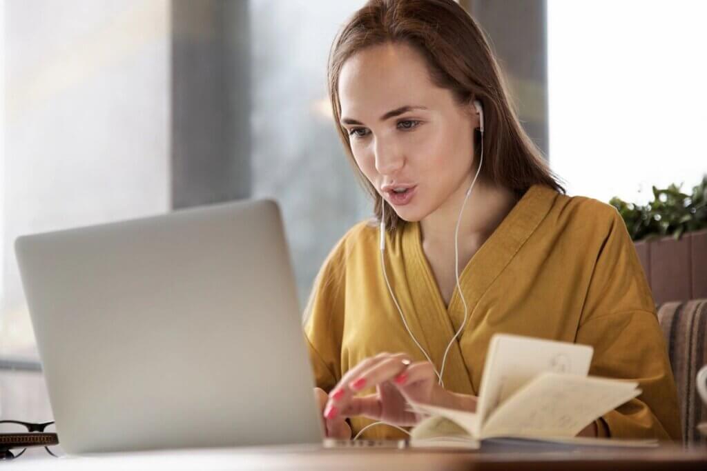 A stock photo of a college student on her laptop.