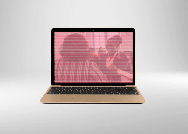 A graphic of a Mac laptop with students talking on the screen during the CUNY SPS virtual career fair.