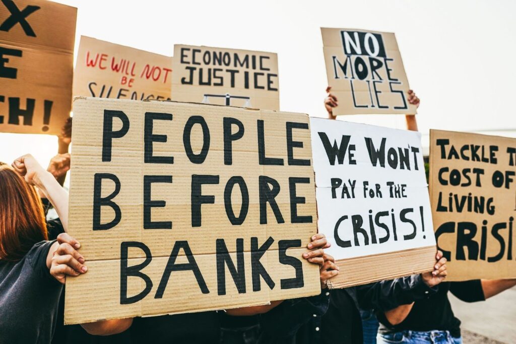 Protesters holding signs