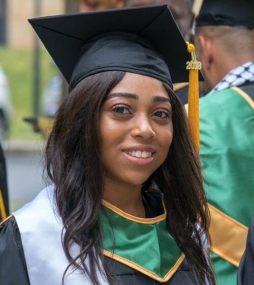 Jessica Barnes in a graduation cap and gown.